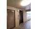 Hallway view with elevator and laundry room entrance for added convenience at 4920 Locust Ne St # 203, St Petersburg, FL 33703