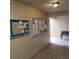 Community hallway with bulletin board and bench at 4920 Locust Ne St # 203, St Petersburg, FL 33703