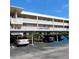 Assigned covered parking spot for unit 203 offers elevator and stair access to floors above at 4920 Locust Ne St # 203, St Petersburg, FL 33703