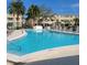 A pristine swimming pool is surrounded by lounge chairs, perfect for relaxation at 4920 Locust Ne St # 203, St Petersburg, FL 33703
