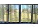 A picturesque view of the complex grounds through large windows with vertical blinds at 4920 Locust Ne St # 203, St Petersburg, FL 33703