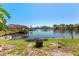 Waterfront backyard featuring a canal view, a dock and a kayak at 6320 Grand Bahama Cir # 6320, Tampa, FL 33615