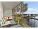 Relax on this screened-in balcony featuring comfortable seating with a scenic waterfront view at 6320 Grand Bahama Cir # 6320, Tampa, FL 33615