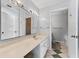 Clean bathroom featuring an extended vanity, sink, large mirrors, and toilet at 6320 Grand Bahama Cir # 6320, Tampa, FL 33615