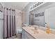 Well-lit bathroom with a combined shower and tub, and a large mirror at 6320 Grand Bahama Cir # 6320, Tampa, FL 33615