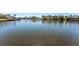 Water view of peaceful canal lined with residences, boat docks and lovely landscaping at 6320 Grand Bahama Cir # 6320, Tampa, FL 33615