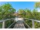 View from dock surrounded by lush greenery over serene water leading to neighborhood homes at 6320 Grand Bahama Cir # 6320, Tampa, FL 33615