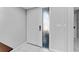 Bright white textured front door with sidelight featuring decorative glass at 6320 Grand Bahama Cir # 6320, Tampa, FL 33615