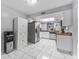 Spacious kitchen with white cabinets, stainless steel appliances, and light tiled flooring at 6320 Grand Bahama Cir # 6320, Tampa, FL 33615