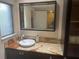 Bathroom vanity featuring a marble countertop and built in storage at 103 Old Mill Pond Rd, Palm Harbor, FL 34683