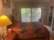The spacious primary bedroom boasts access to a rear deck and lots of natural light at 103 Old Mill Pond Rd, Palm Harbor, FL 34683