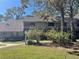 Charming townhome with a private balcony and mature landscaping nestled among trees in a tranquil setting at 103 Old Mill Pond Rd, Palm Harbor, FL 34683