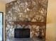 Stone fireplace with wooden mantle adds rustic charm to the living space at 103 Old Mill Pond Rd, Palm Harbor, FL 34683
