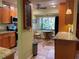 Well-equipped kitchen with granite countertops, stainless steel appliances, breakfast nook, and custom cabinets at 103 Old Mill Pond Rd, Palm Harbor, FL 34683