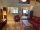 Inviting living room with hardwood floors, comfortable seating, and staircase access, perfect for relaxing and entertaining at 103 Old Mill Pond Rd, Palm Harbor, FL 34683