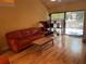 Warm living room with hardwood floors, comfortable seating, and natural light, creating a welcoming and relaxing atmosphere at 103 Old Mill Pond Rd, Palm Harbor, FL 34683
