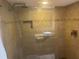 Modern shower with tile surround, glass doors, and sleek fixtures at 103 Old Mill Pond Rd, Palm Harbor, FL 34683