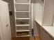 Spacious walk-in closet with ample shelving and storage, designed to keep your wardrobe organized and accessible at 103 Old Mill Pond Rd, Palm Harbor, FL 34683