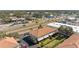 Aerial view of the property in a bustling area near shops and roadways at 1264 Riserva Ln, Palm Harbor, FL 34683