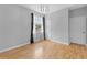 Bedroom with hardwood floors, a ceiling fan and large window with natural light at 1264 Riserva Ln, Palm Harbor, FL 34683