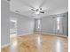 Large main bedroom with hardwood floors, ceiling fan and bathroom access at 1264 Riserva Ln, Palm Harbor, FL 34683
