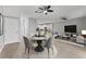 Dining area with modern lighting, stylish decor, and open concept layout at 1264 Riserva Ln, Palm Harbor, FL 34683