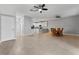 Open dining area with view into living area and kitchen. Features tile floor and ceiling fan at 1264 Riserva Ln, Palm Harbor, FL 34683