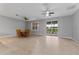 Open dining area with tile floor, ceiling fan, and sliding glass door at 1264 Riserva Ln, Palm Harbor, FL 34683