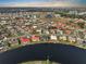 A scenic aerial view of a residential community nestled around a beautiful lake at 1809 Wolf Laurel Dr, Sun City Center, FL 33573