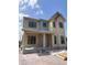 New two-story home featuring black window trim and a light beige exterior at 3640 15Th N St, St Petersburg, FL 33704