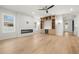 Bright living room with fireplace, built-in shelving, and hardwood floors at 3640 15Th N St, St Petersburg, FL 33704