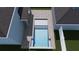 Aerial view of a rectangular pool with integrated steps and a paver patio at 3640 15Th N St, St Petersburg, FL 33704