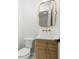 Chic powder room featuring gold accents, modern fixtures, and a stylish mirror at 3640 15Th N St, St Petersburg, FL 33704