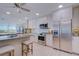 This kitchen features white cabinetry, granite countertops, stainless steel appliances, and a large island at 7600 Sun Island S Dr # 804, South Pasadena, FL 33707