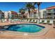 Relaxing hot tub surrounded by lounge chairs near lush tropical landscaping at 800 S Gulfview Blvd # 101, Clearwater Beach, FL 33767