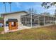 The backyard features a screened-in pool with a playhouse, perfect for entertaining or relaxing at 1753 Lucas Dr, Clearwater, FL 33759