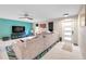 Bright living room featuring a comfortable couch, modern ceiling fan, and lots of natural light at 1753 Lucas Dr, Clearwater, FL 33759
