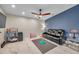 Comfortable living room featuring modern ceiling fan, adjacent to a sleek blue accent wall at 1753 Lucas Dr, Clearwater, FL 33759