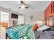 Well-lit bedroom featuring wood furniture and ensuite bathroom at 1753 Lucas Dr, Clearwater, FL 33759