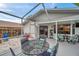 Covered patio with dining set, offering a cozy outdoor dining experience at 1753 Lucas Dr, Clearwater, FL 33759