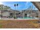 Enjoy the privacy of this screened pool with plenty of space for dining and lounging at 1753 Lucas Dr, Clearwater, FL 33759