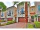 Elegant multi-story townhouse with private balconies, lush landscaping, and two-car garages at 3222 W Empedrado St, Tampa, FL 33629