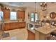 Spacious kitchen with granite countertops, a breakfast bar, and a view of the dining room at 3222 W Empedrado St, Tampa, FL 33629