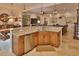 Open kitchen with granite countertops, stainless steel appliances, and seamless flow to the living spaces at 3222 W Empedrado St, Tampa, FL 33629