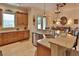 Bright kitchen with granite countertops, stainless steel appliances, and a view of the dining area at 3222 W Empedrado St, Tampa, FL 33629