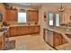 Modern kitchen features granite countertops, stainless steel appliances, and custom cabinetry at 3222 W Empedrado St, Tampa, FL 33629