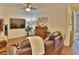 Comfortable living room with a leather sofa, large TV, and stylish decor accents at 3222 W Empedrado St, Tampa, FL 33629