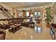 Spacious living area with a comfortable sofa, open layout, and seamless transition to dining and kitchen at 3222 W Empedrado St, Tampa, FL 33629