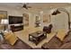 Spacious living room with a large TV, leather seating, and elegant decor at 3222 W Empedrado St, Tampa, FL 33629