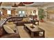 Inviting living room features a large sectional sofa, neutral tones, and open floor plan at 3222 W Empedrado St, Tampa, FL 33629